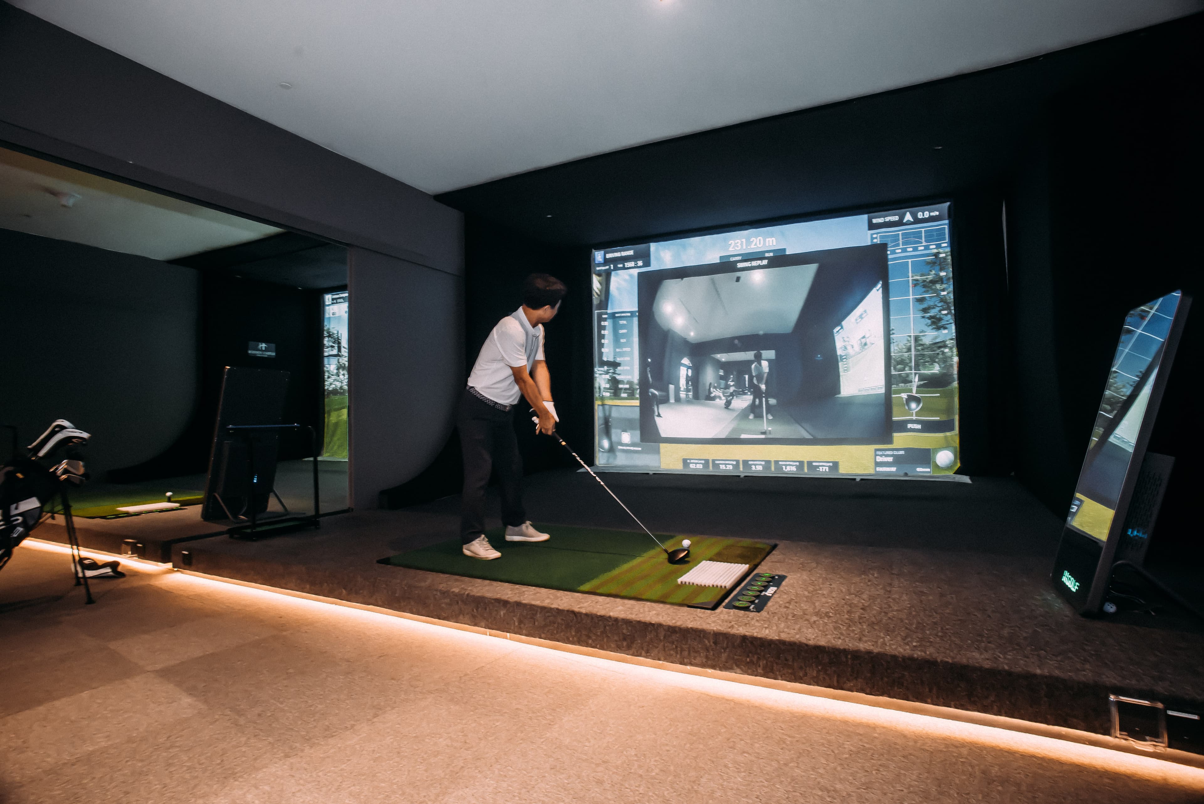 Golfer using a KGolf simulator at Hidden Castle Golf Club